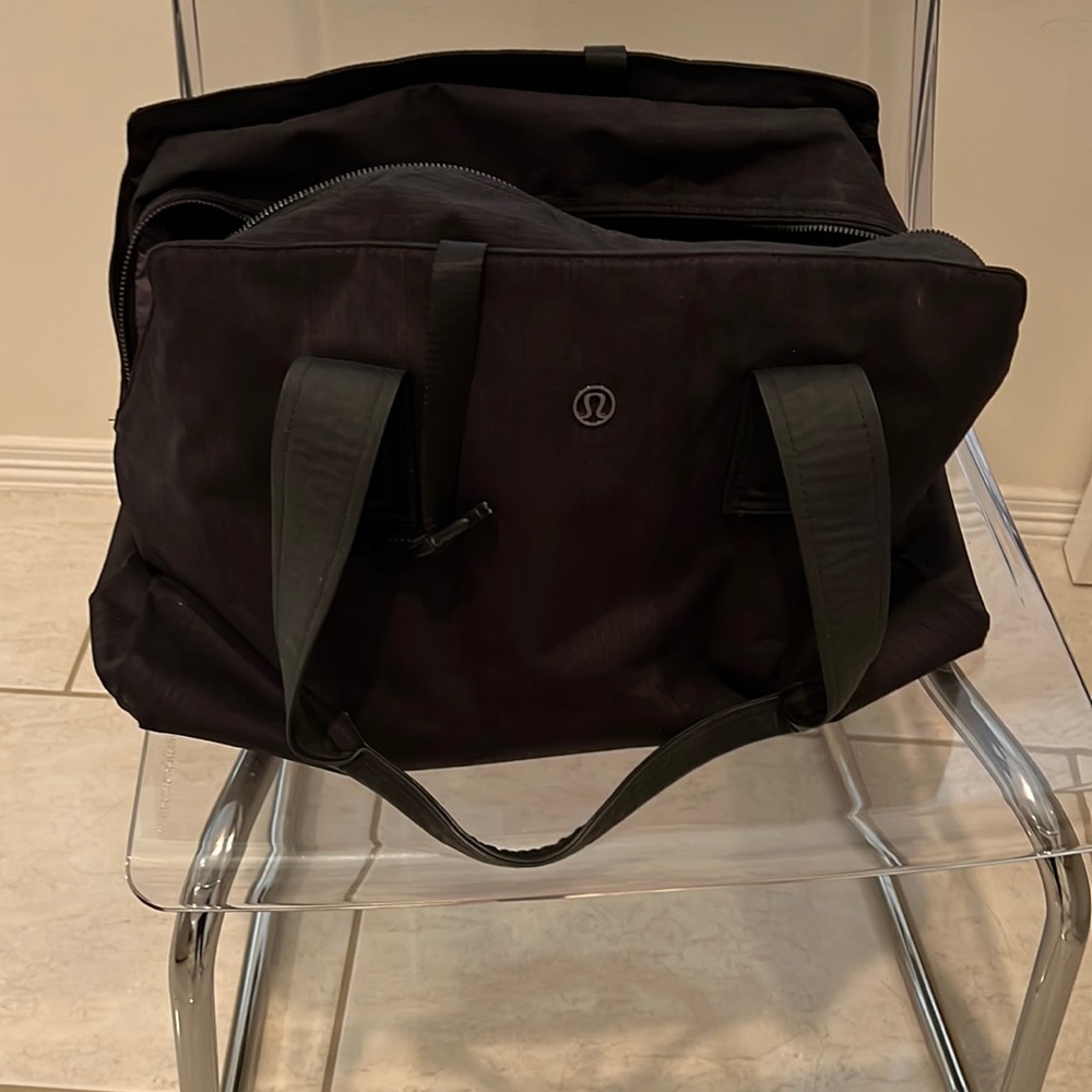 Black Lululemon Gym Bag and has a strap for yoga mat